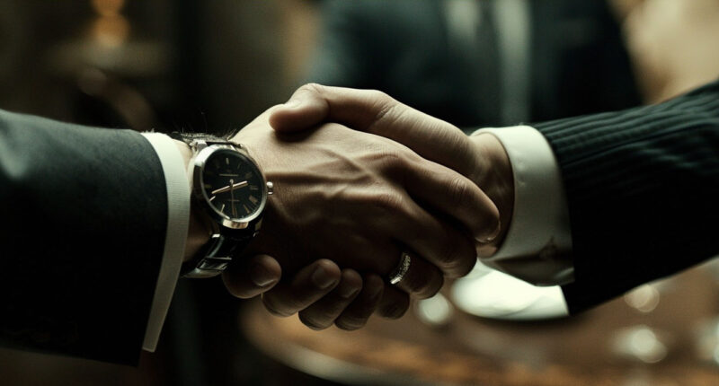 Business handshake, two men in suits shaking hands